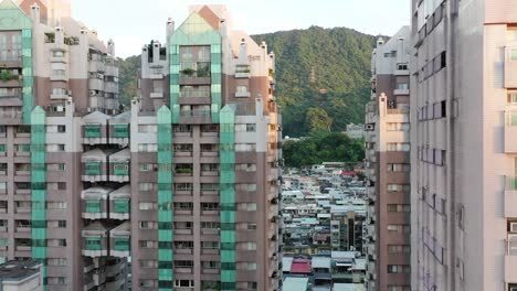 aerial elevation shot capturing the properties in early developments, old ageing high rise apartment facade in downtown xinyi district, taipei city, taiwan