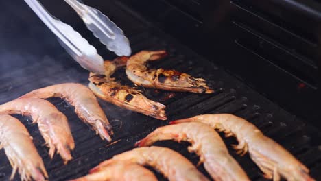 sequential grilling of shrimp on a hot grill