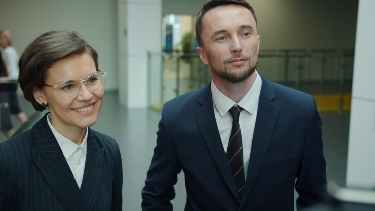 Business Conversation in Office Corridor