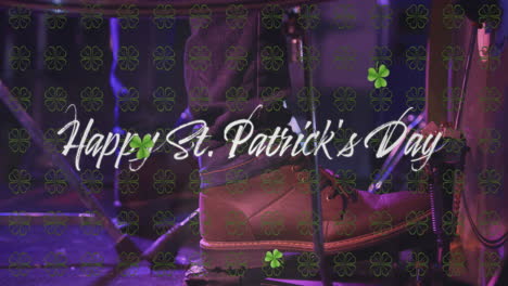 animation of happy st patrick's day text and clover icons over man playing drums