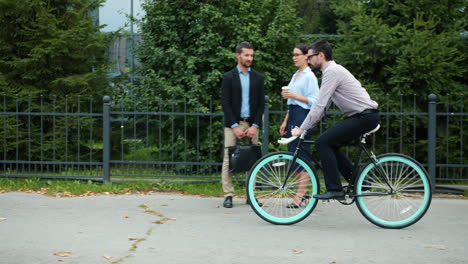 businessman riding a bicycle in the city
