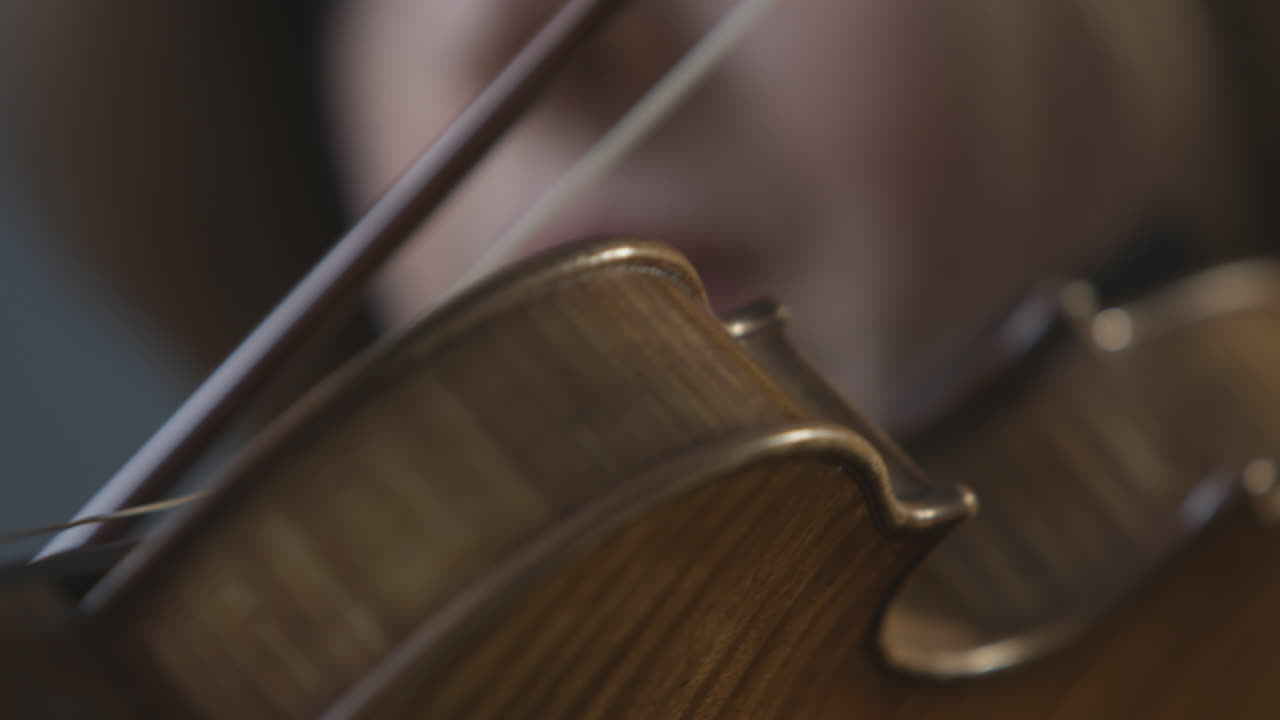 A woman plays a violin