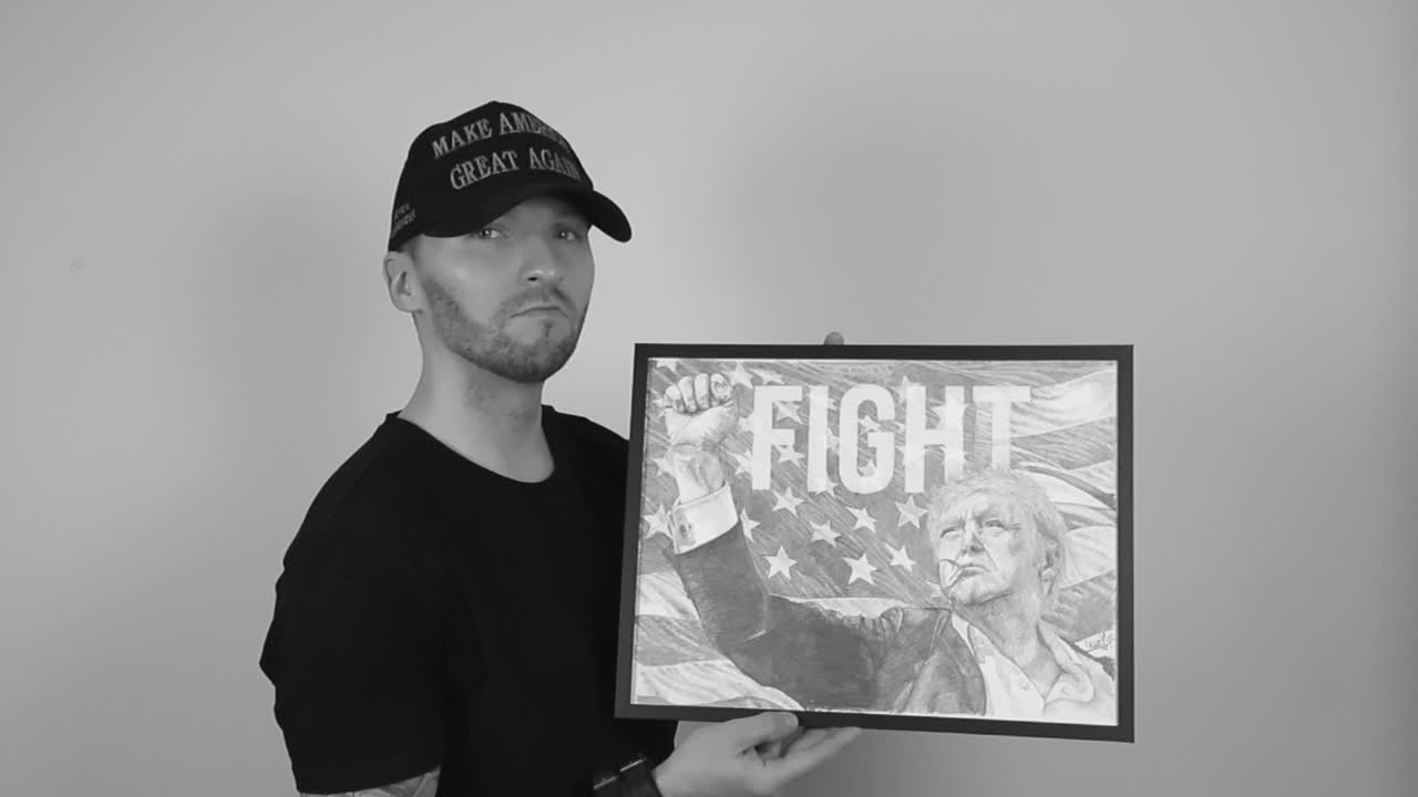 Grayscale footage of a tattooed man with MAGA or Make America Great Again hat lifting up a drawing of Donald J Trump, the President of the United states. Man nodding and is confident and happy.