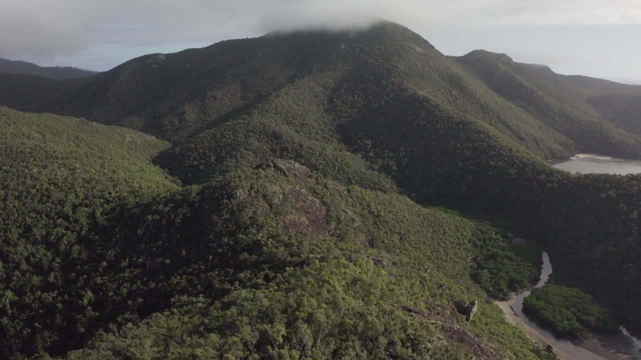Aerial View of Lush Green Mountains and Coastline