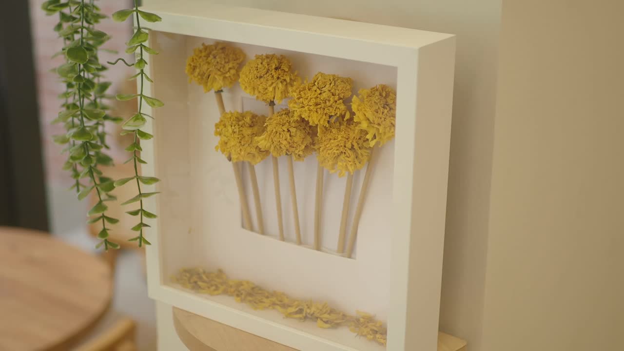 Dried Yellow Flowers in a White Frame