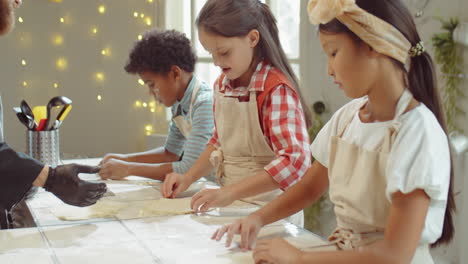 baker giving cooking masterclass to kids