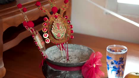 closeup hand hold incense sticks to chinese altar after praying to god and the meaning is god protect and may all wishes come true.