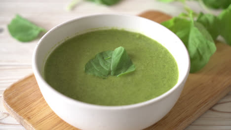 spinach soup bowl on wood table