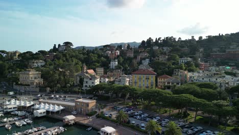 An-aerial-view-over-marina-and-town-on-hills,-summer-in-Rapallo,-Italy