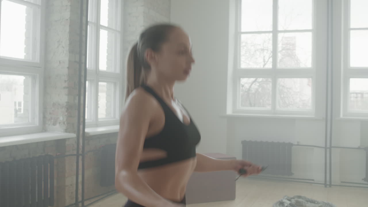 Sports Woman Jumping Rope At Workout
