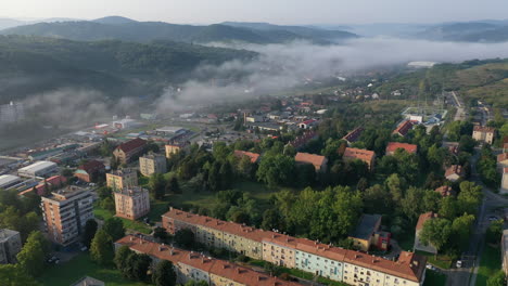 Flying-over-city-area-in-autumn-morning