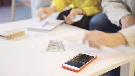 close-up of married couple calculating household budget.