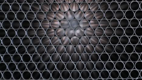 abstract background of steel pipes stacked on a pallet