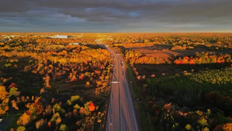 Aerial-fall-morning-light-over-a-highway