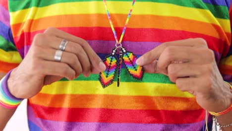 Detail-of-young-man-in-rainbow-LGBTQ-pride-tshirt-and-rainbow-necklace