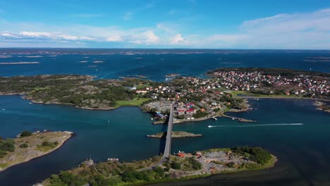 bridge and locality at donso island with boats cruising in the blue sea. - aerial