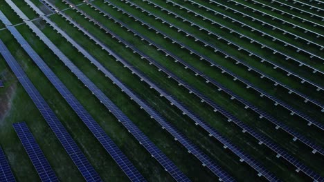 aerial exploration of solar farm amidst industrial structures