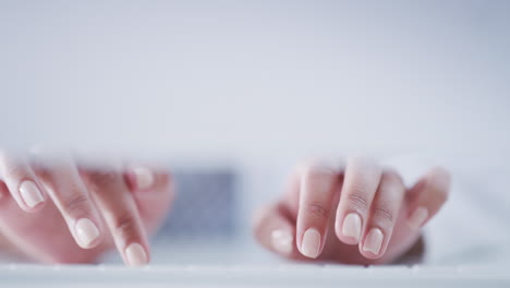 Hands-typing-on-a-computer-keyboard-working