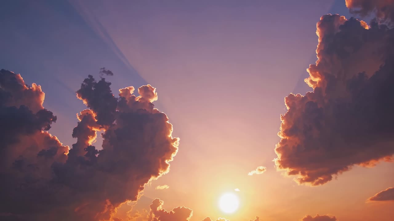 A stunning sunset video captures dramatic clouds from a low angle, highlighting the vibrant hues