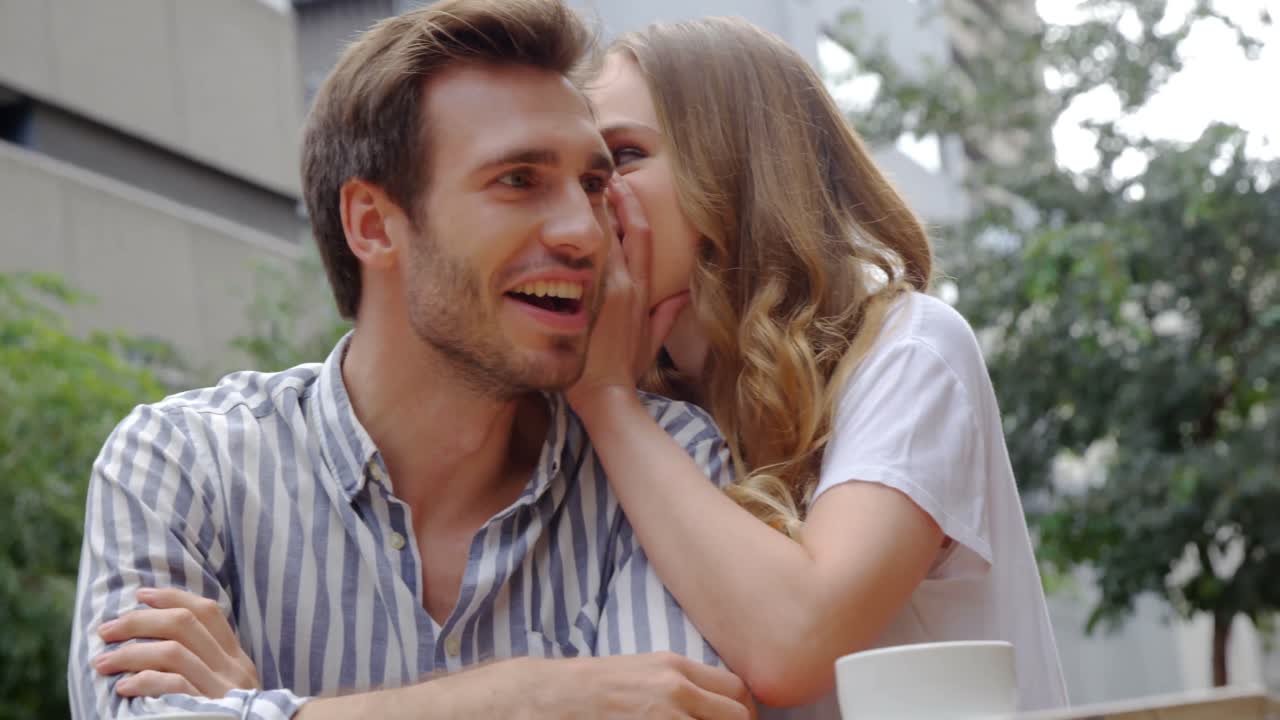 Woman whispering  in mans ear 4k