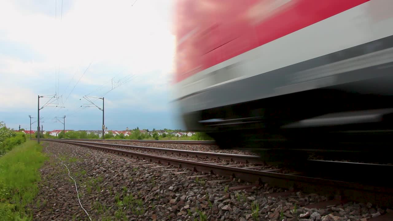 Fast Red Train Moving Through the Countryside