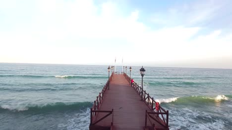 flying over wooden pier in marbella malaga spain