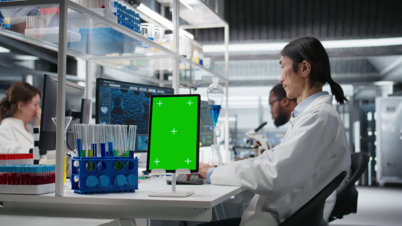 Vertical video Lab engineer using isolated screen tablet for DNA data analysis