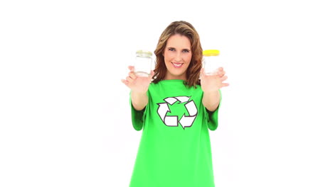 smiling environmental activist showing jars