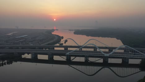 sunrise over the river and bridge