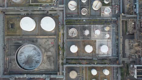 aerial view oil and gas industrial, refinery factory oil storage tank and pipeline steel at night