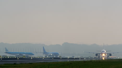 planes landing and taking off in foggy conditions at airport