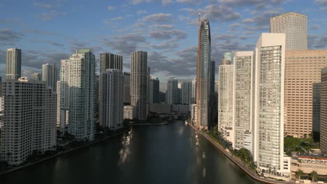 drone shot miami city skyline in florida with skyscrapers and sun, usa