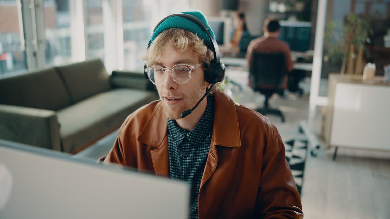 Man with Headset Working in Modern Office