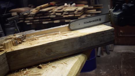 Close-Up-Of-Professional-Carpenter-Work-Piece-Of-Wood-With-Electric-Chainsaw