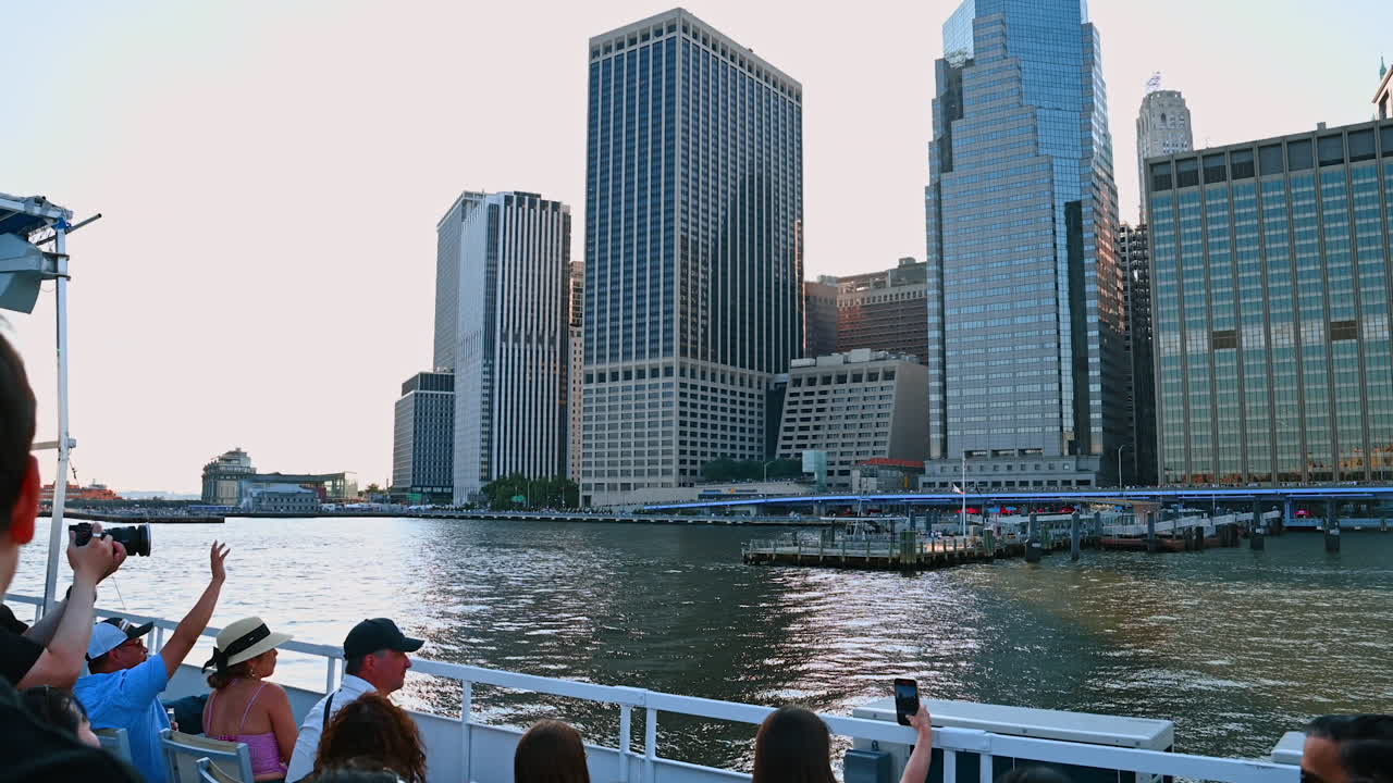 NEW YORK - AUGUST 2014: Cruise yacht with Manhattan skyline in the background on August 11, 2014. Manhattan is the central part of NYC. It is one of the worlds leading cultural and economic centers