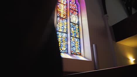 south african catholic church, revealing a beautiful stained glass window with sunshine coming through