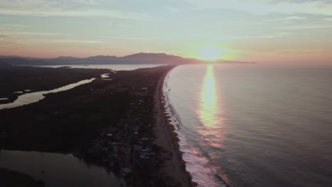 aerial wide angle drone shot of sunset near acapulco beach in mexico city