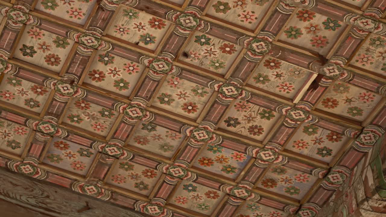 Painted Traditional Korean Ceiling With Floral Patterns In Pastel Tones. Framed By Wooden Lattice Beams In Square Grid Layout.. low angle shot