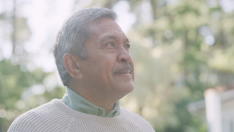 carefree senior man drinking coffee in nature