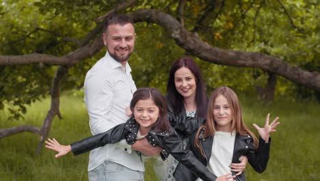 happy family portrait in a park