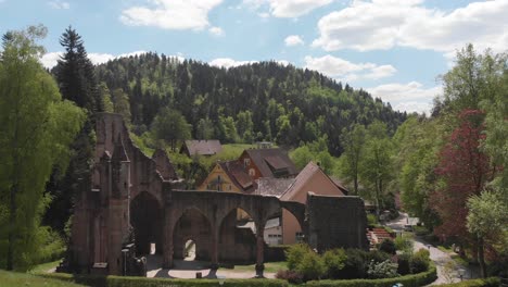 take off from behind hill revealing the allerheiligen monastery ruins