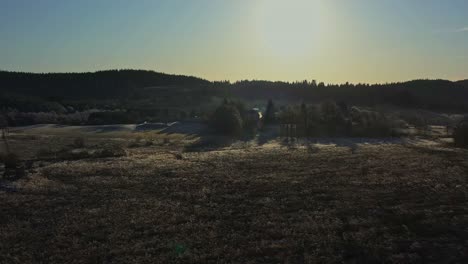 Aerial-Scenic-Views-Across-Scottish-Fields-with-Low-Sunlight-Casting-Shadows-near-Aberfoyle,-Scotland