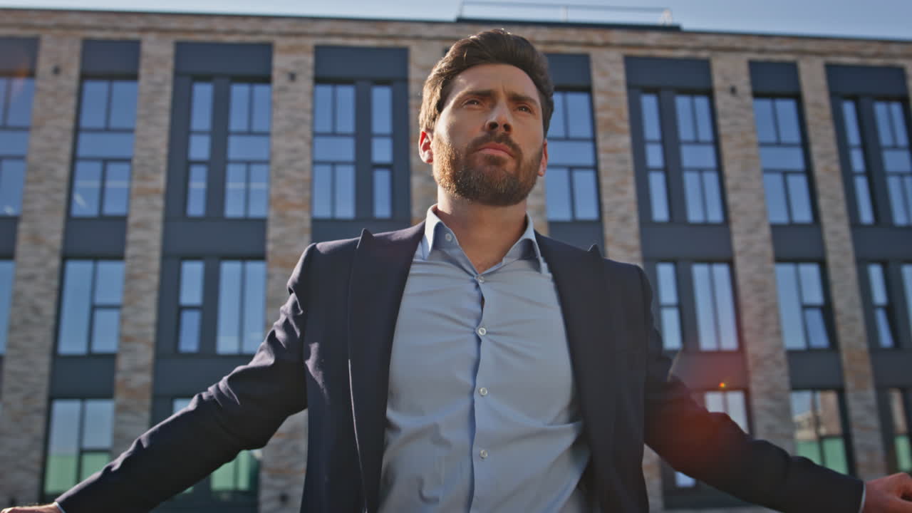 Pensive boss thinking business watching city view in sunny downtown closeup