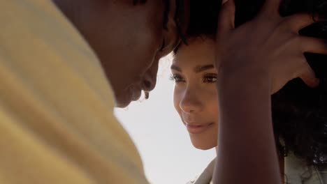 Couple-embracing-each-other-on-the-beach-4k