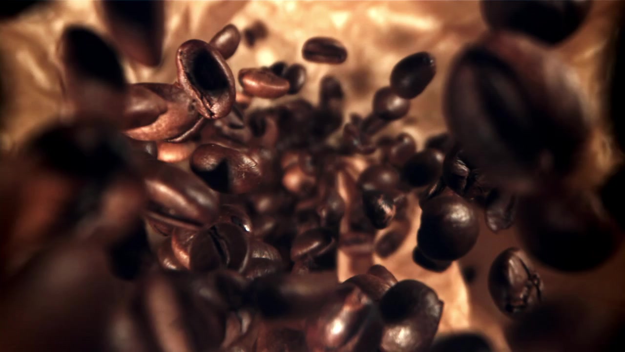 Roasted Coffee Beans Falling in Slow Motion Close Up