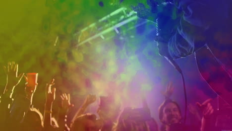 male performer singing into microphone in music concert, with animated light beams and notes