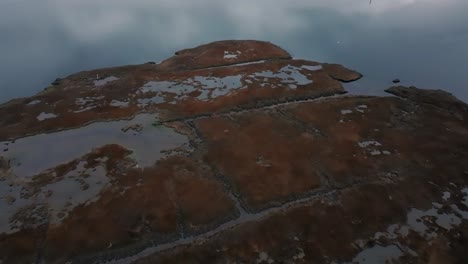 An-aerial-view-over-the-salt-marsh-by-Freeport,-New-York-on-a-cloudy-day