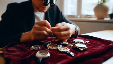 watchmaker repairing watches