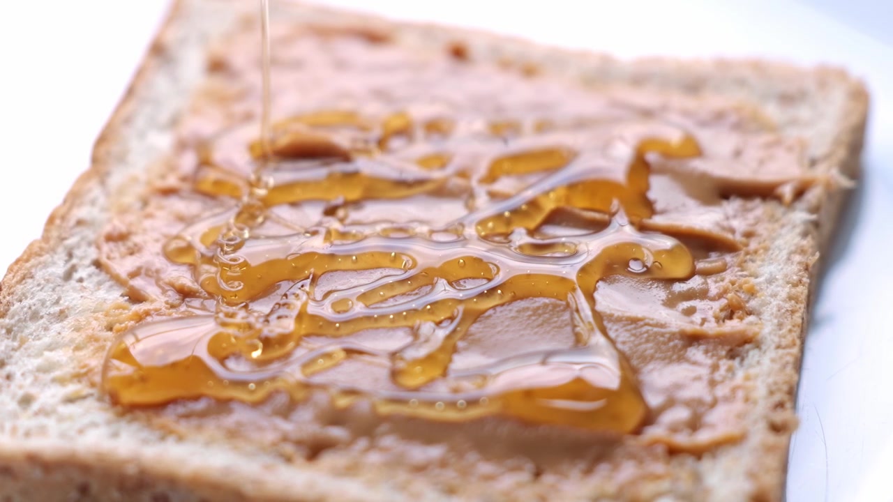 Peanut Butter Toast with Honey Drizzle, Crispy Bread Texture, and Sweet Breakfast Food Scene