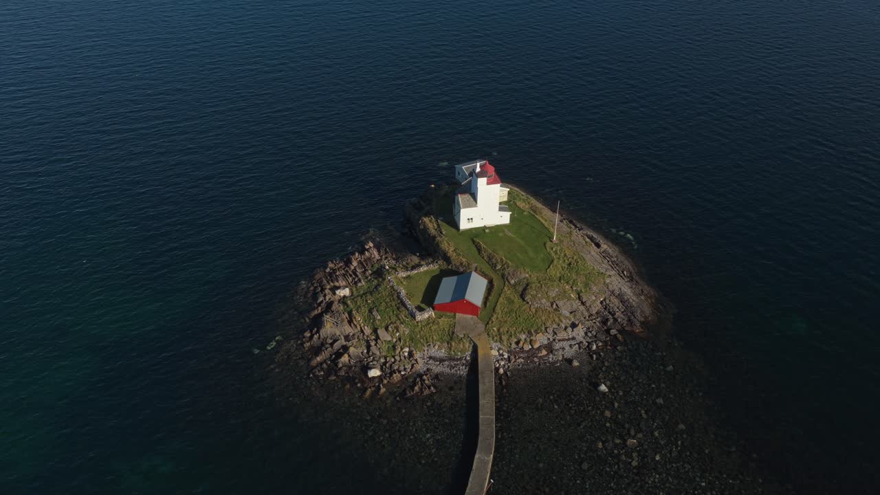 Scenic lighthouse view from the air along Smola coastline, Norway